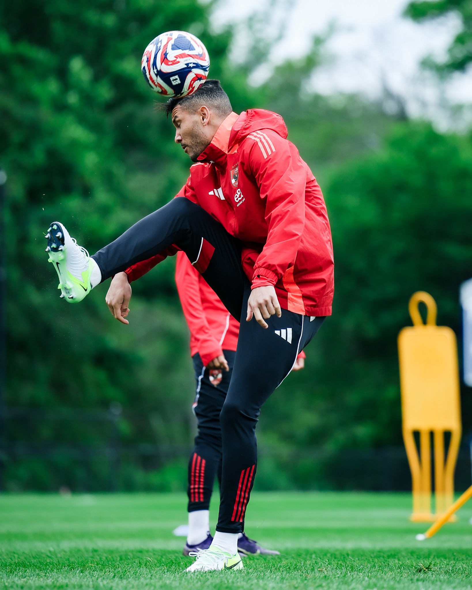 May be an image of 1 person, playing football, playing soccer and cleats
