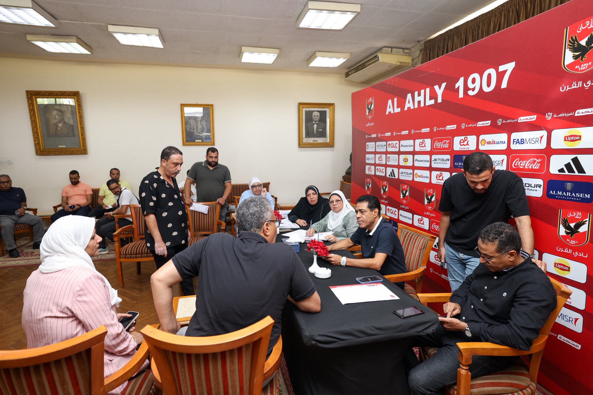 May be an image of 10 people and text that says 'القرن AL AHLY 1907 N لفرياضة شحده Cerra e HTxилB FABMISR Lapton ISRT CocsCola 1QUC OUR Mu- ALMARASEN ည ناديالقرن القرن نادي Lipton ISRT Cams'