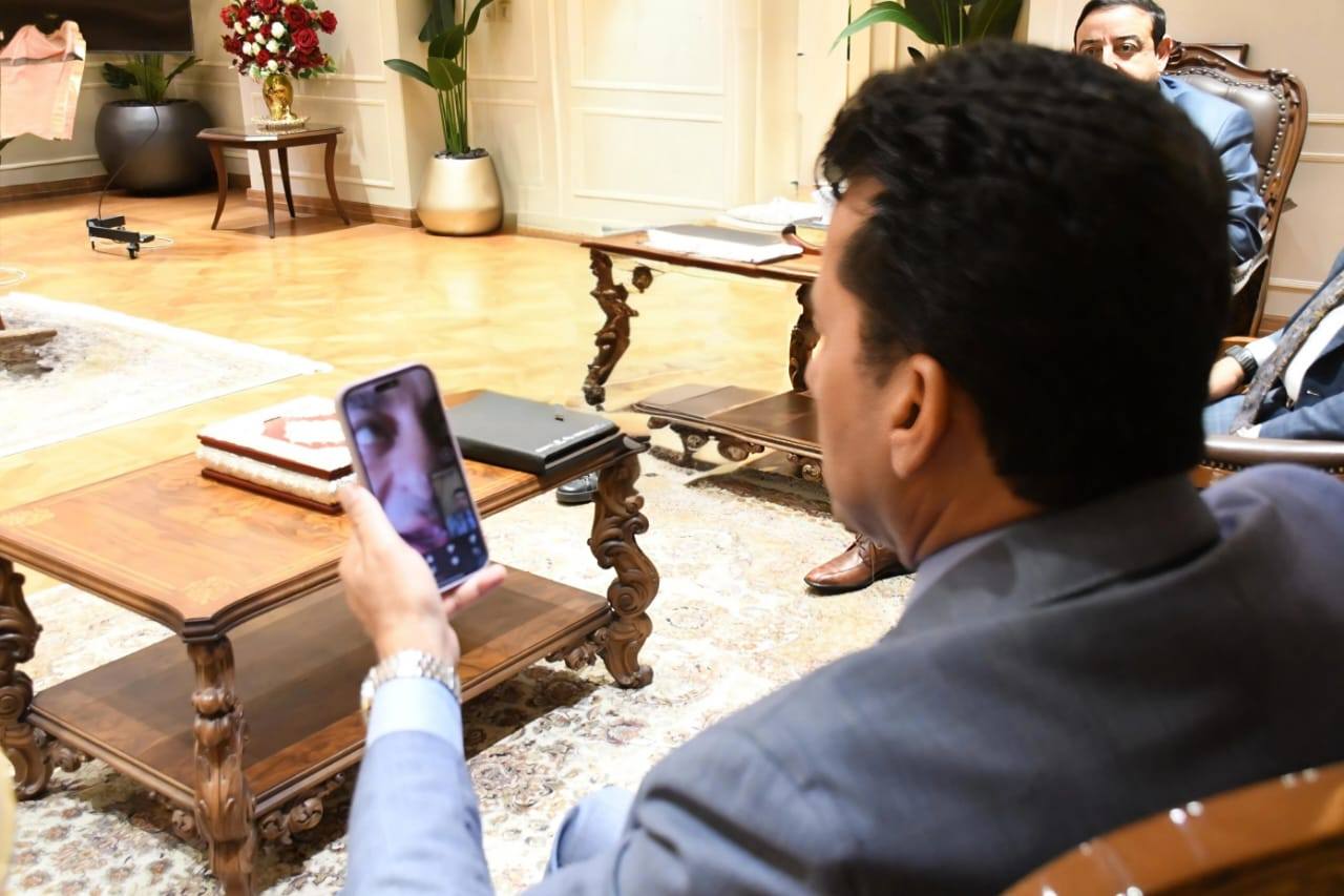 May be an image of 1 person, television, phone and the Oval Office