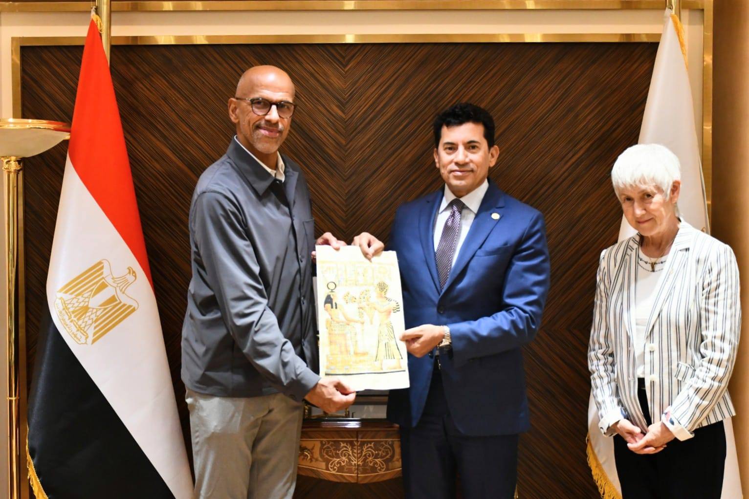 May be an image of 3 people, dais and text