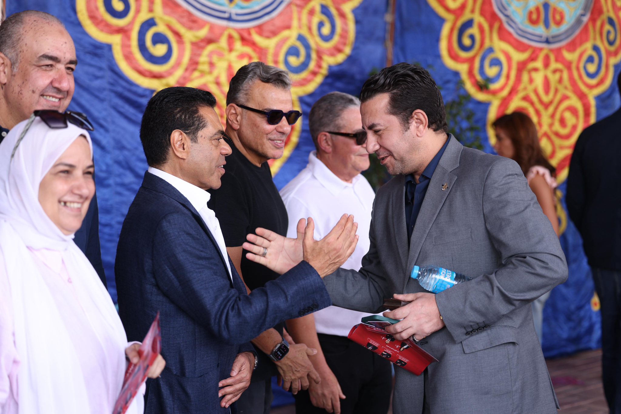 May be an image of one or more people and text