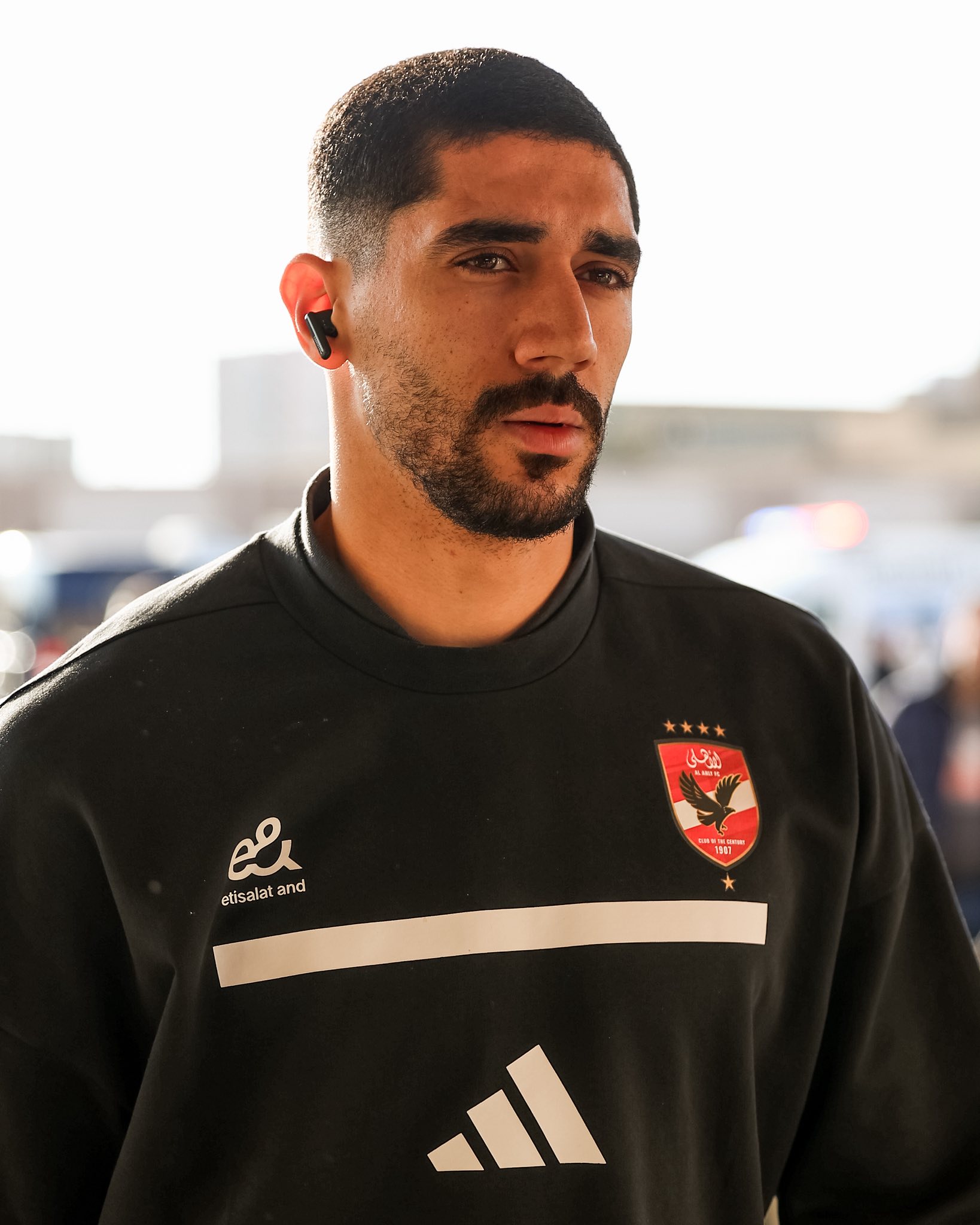 May be an image of one or more people, beard, people playing football, people playing soccer and text